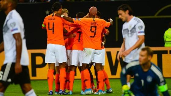 Netherlands' players celebrate scoring during the UEFA Euro 2020 Group C qualification football match between Germany and the Netherlands in Hamburg, northern Germany, on September 6, 2019. (Photo by PATRIK STOLLARZ / AFP) (Photo credit should read PATRIK STOLLARZ/AFP/Getty Images)